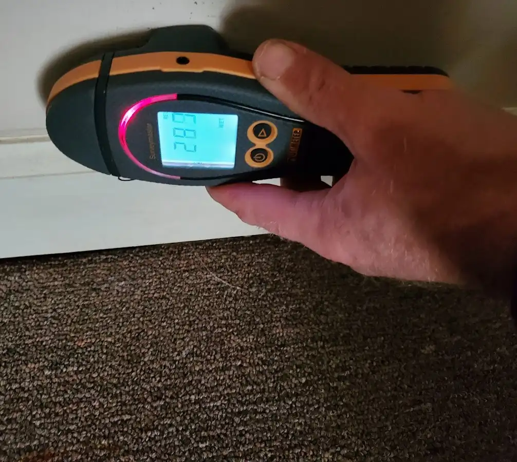 Moisture detection at baseboard during Storm Damage Restoration in Live Oak